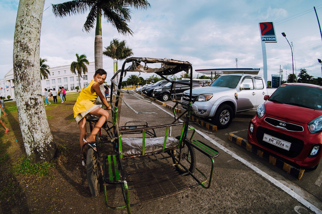 Kid riding a "Trisikad", Bacolod