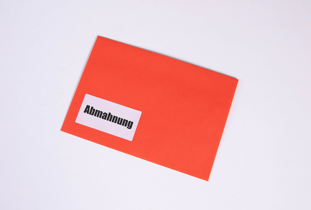 Red envelope with Abmahnung text on white background