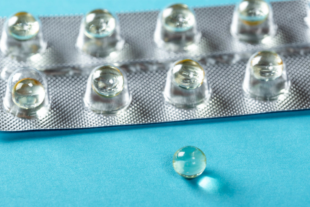 Round tablets on blue background