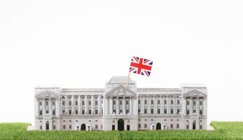 Buckingham Palace model house with UK flag