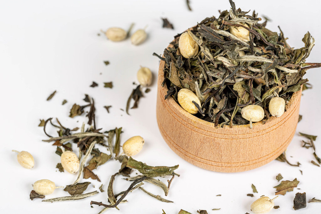 Dried green herbal tea with sea buckthorn berries