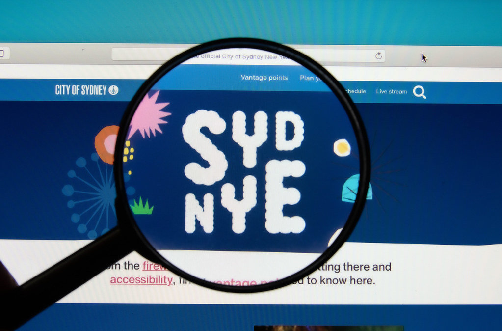 Sydney New Years Eve website with a magnifying glass