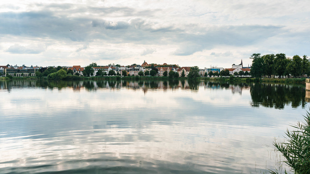 Panorama of beautiful German town Schwerin with reflection in the lake