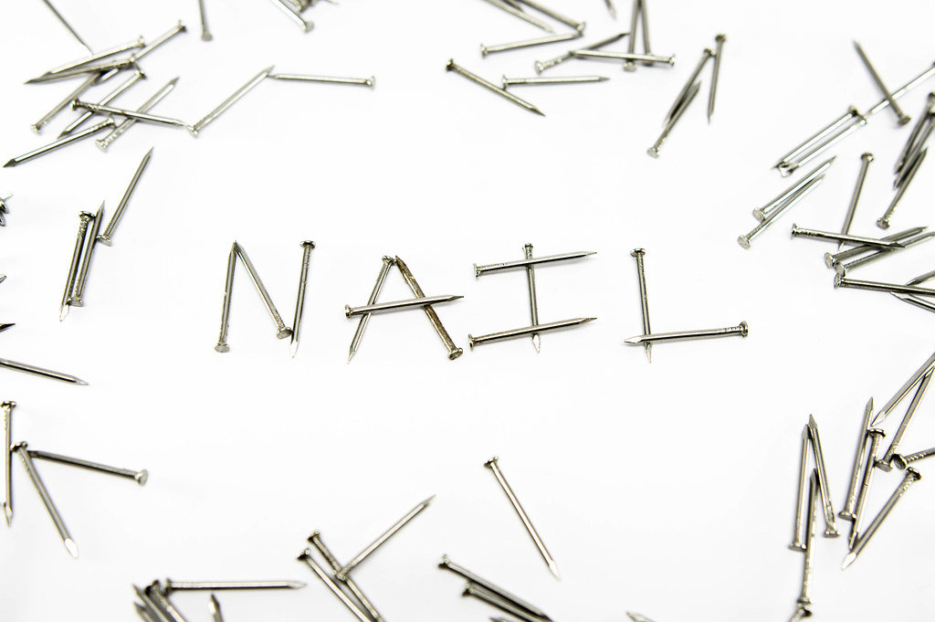 Nails forming the word NAIL