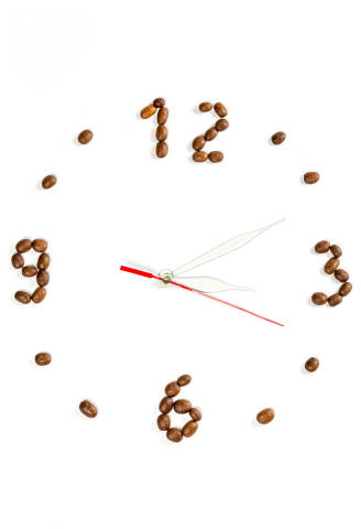 Clock made from roasted coffee beans, top view