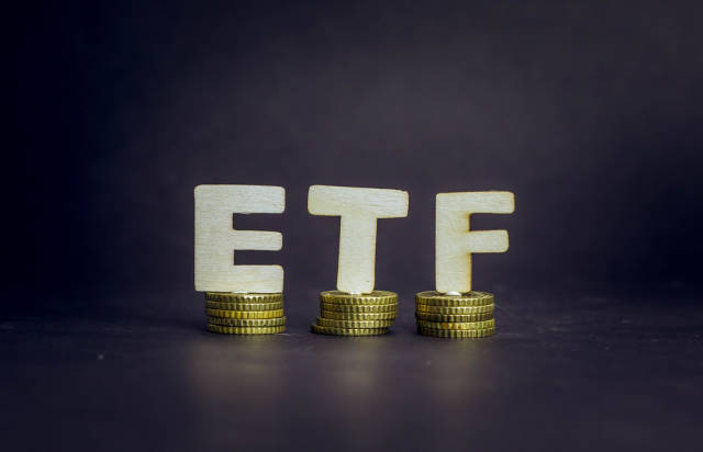 Exchange traded fund - ETF on golden coins