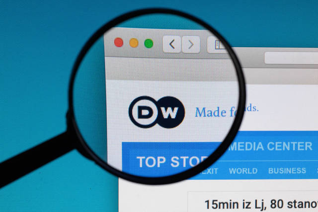 DW logo under magnifying glass