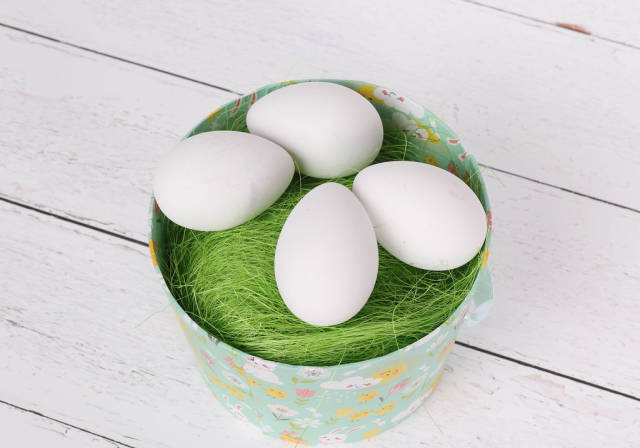 White eggs in a basket