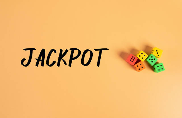 Dices with Jackpot text on orange background