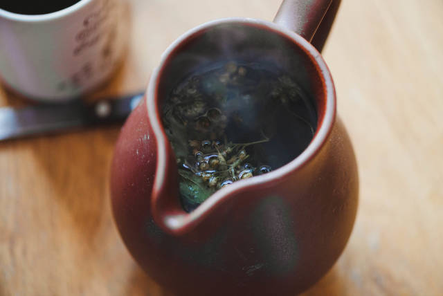 Closeup Of Hot Tea In Ceramic Teapot