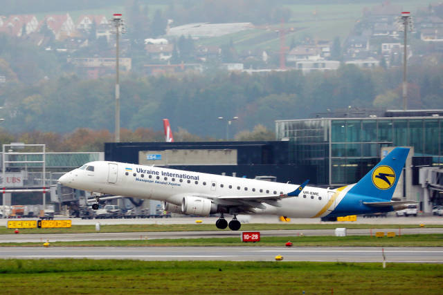 Ukraine International Airlines Embraer takes off from Zurich Airport, UR-EME