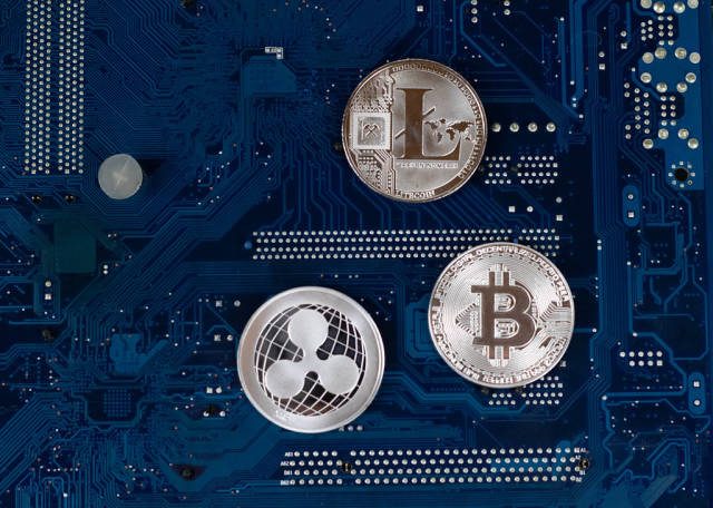 Virtual symbols of the coin Bitcoin, Litecoin and Ripple