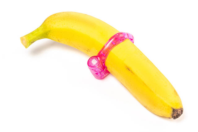 Pink erection ring for men on a banana