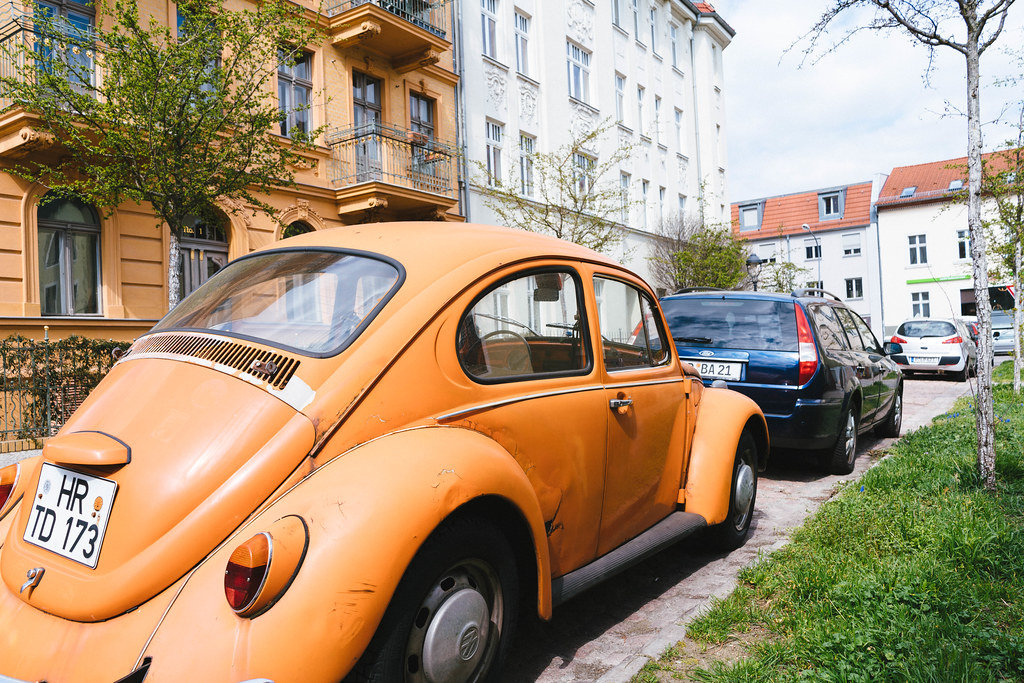 Original orange old Volkswagen Beetle parked in German city