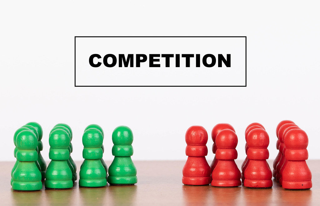 Competition concept with pawn figurines on table