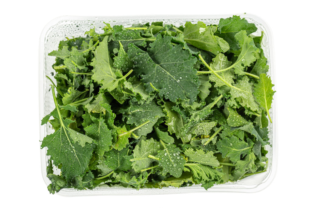 Leaves of kale cabbage on white, top view