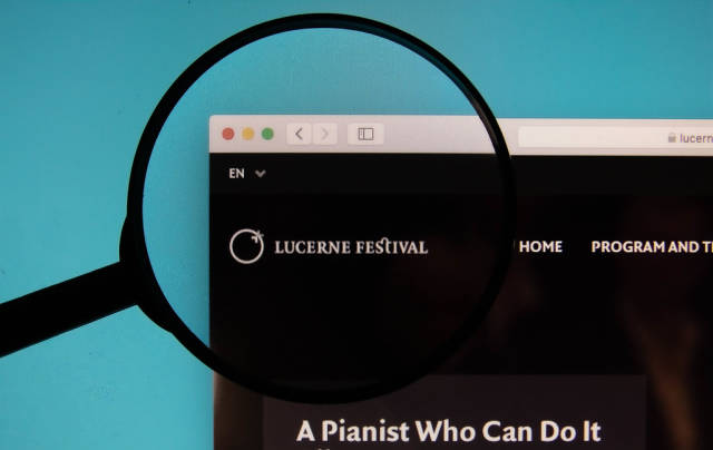 Lucerne Festival logo on a computer screen with a magnifying glass