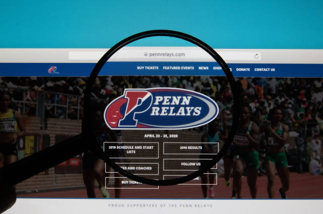 Penn Relays logo on a computer screen with a magnifying glass