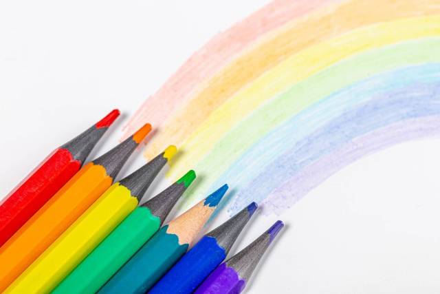 Rainbow and pencils of rainbow colors on white background (Flip 2019)