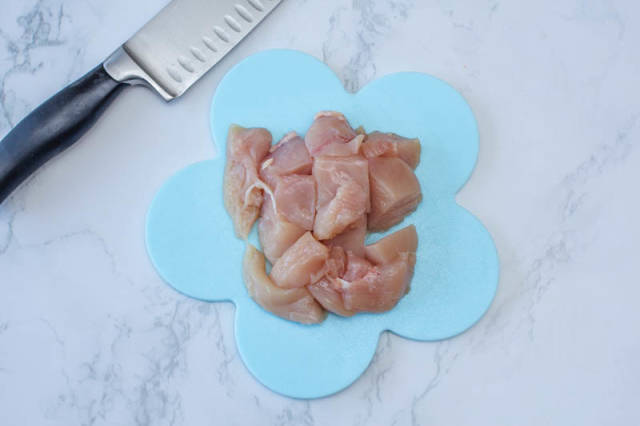 Raw Chicken in Cubes with Knife