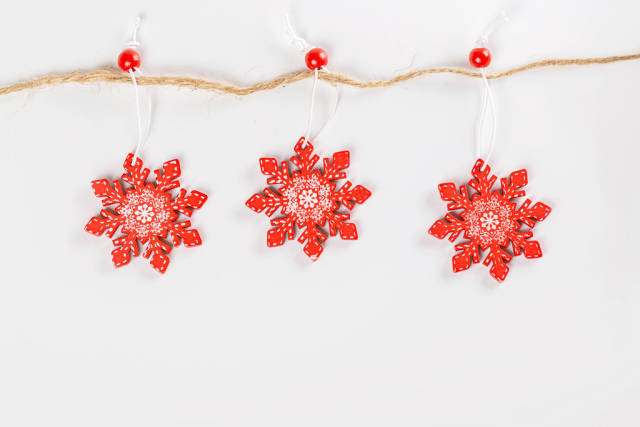 Red snowflakes christmas decor on a rope