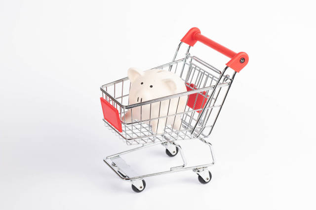Piggybank in shopping cart