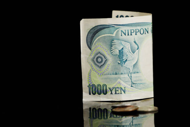 Japanese currency, Yen, on black background