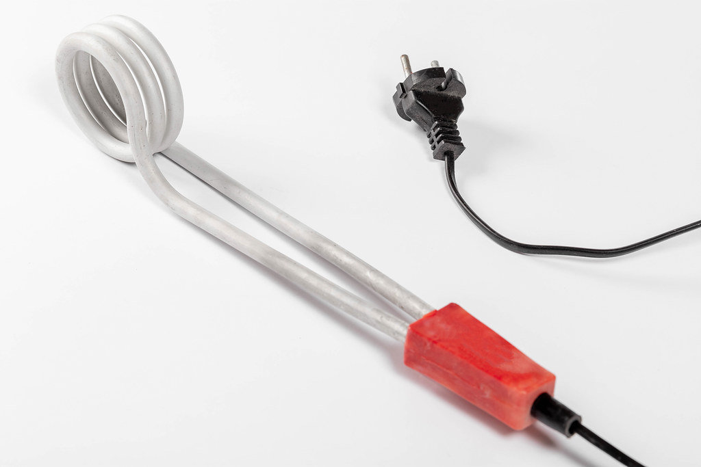 Electric device for heating water on a white background