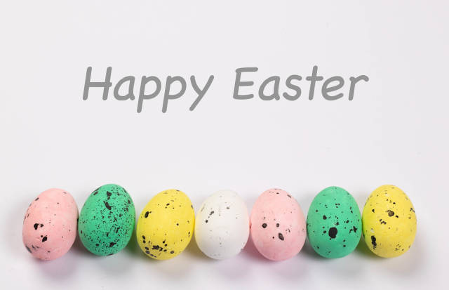 Easter eggs on white background with Happy Easter text