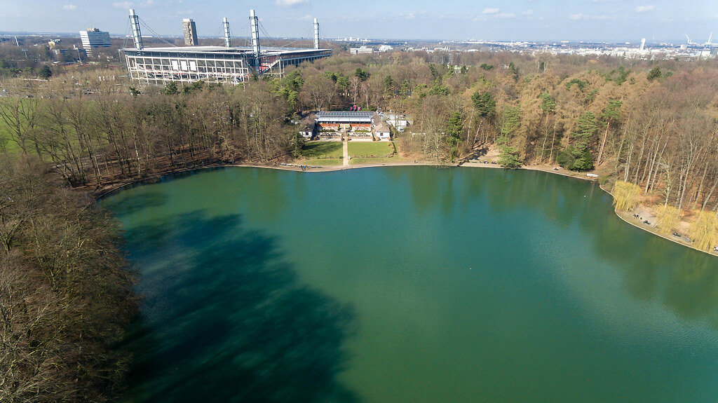 Aerial Drone Photo of Adenauer Weiher with Cologne Bundesliga Stadium RheinEnergieStadion in the Background