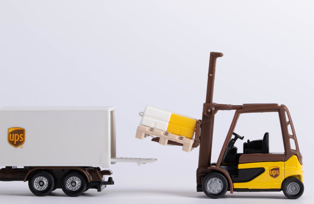 Forklift loading pallet into the UPS truck