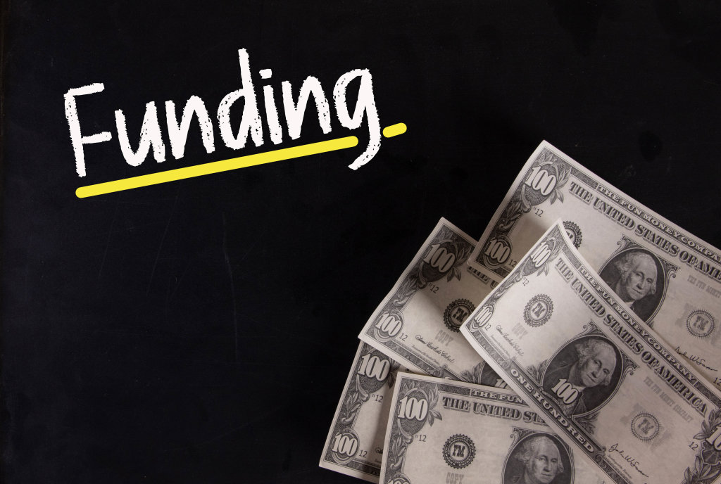 Dollar banknotes with Funding text