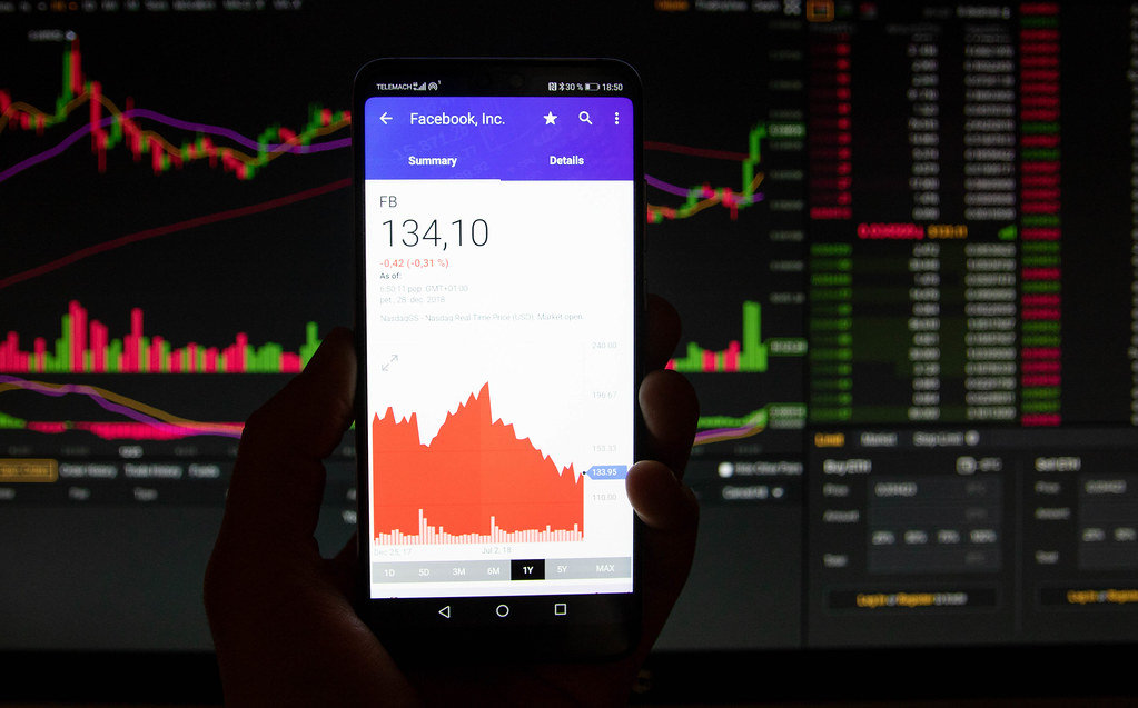 A smartphone displays the Facebook market value