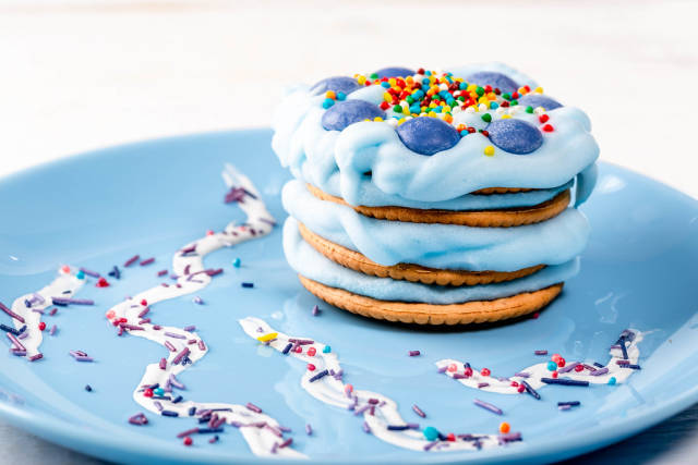 Cake with blue cream on a plate