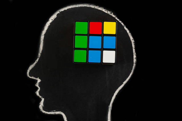 Silhouette of human head with rubiks cube, concept of mind, thinking and ideas