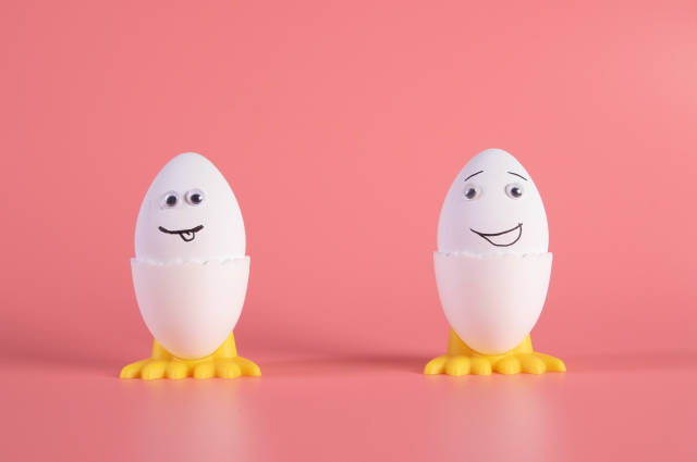 Two Easter eggs on pink background