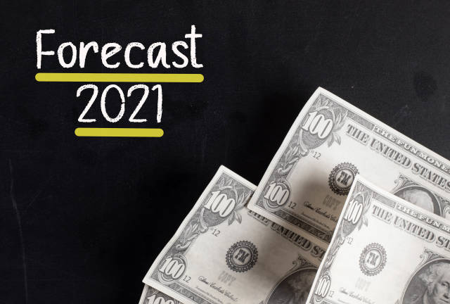 Dollar banknotes with Forecast 2021 text