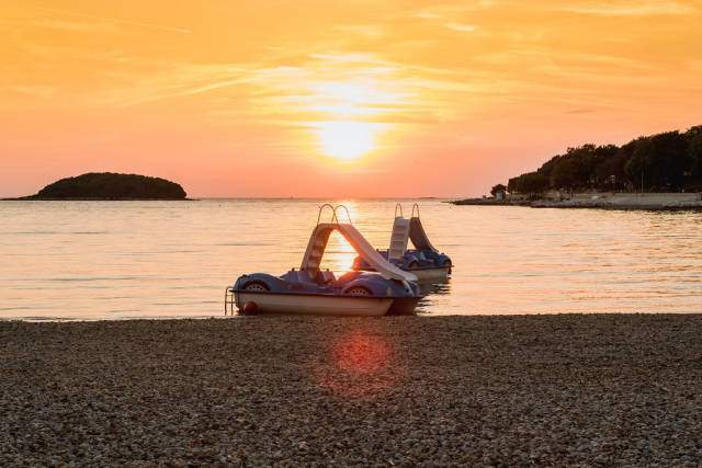 Pedal boats at sunset