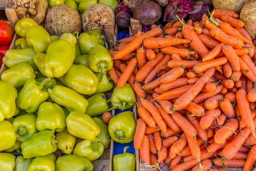 Carrots and paprikas on marketplace