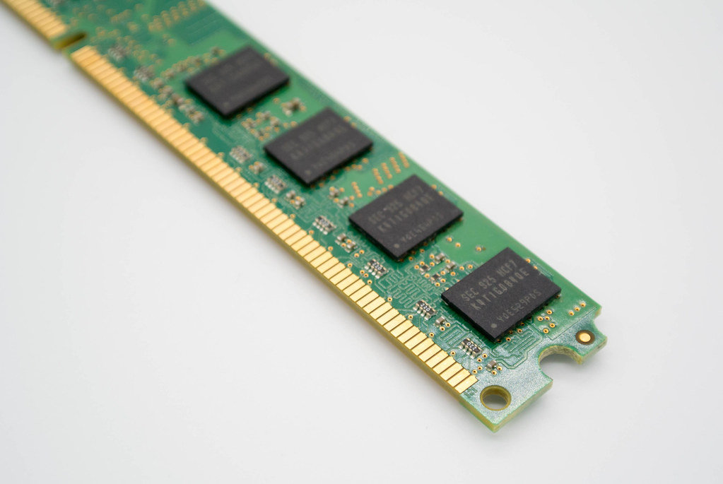 Close-up of a DDR RAM memory module on white background