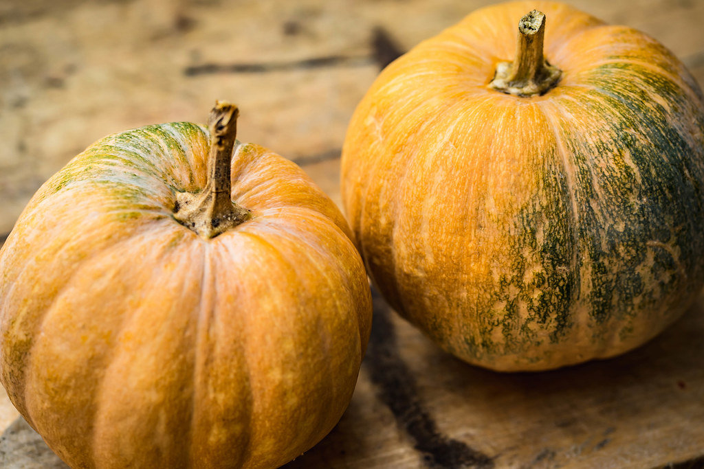Pumpkins on the wooden board