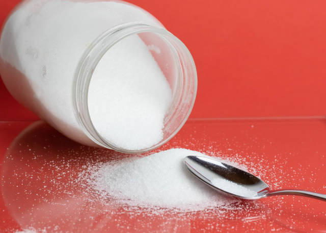 White sugar with spoon
