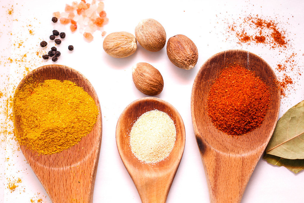 Chili, Curry, Garlic Spices  in Wooden Spoon