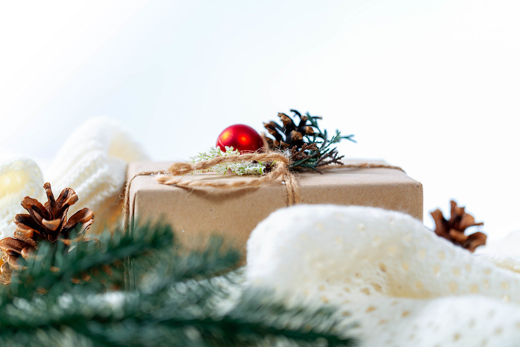 Gift box on a white knitted blanket