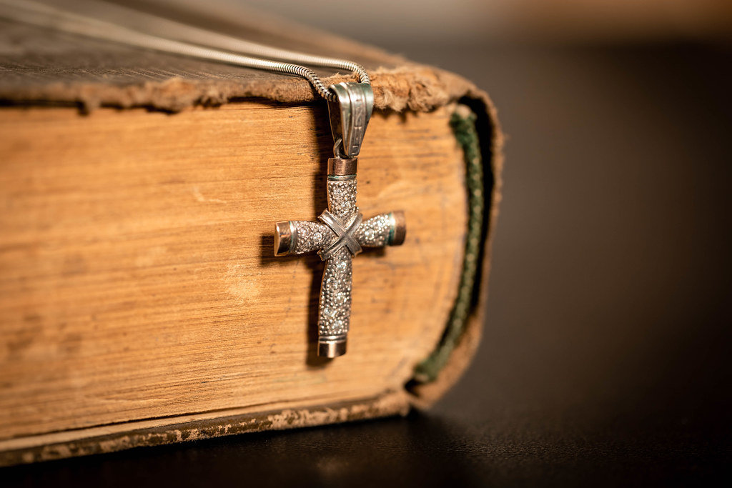 Religious old book with cross