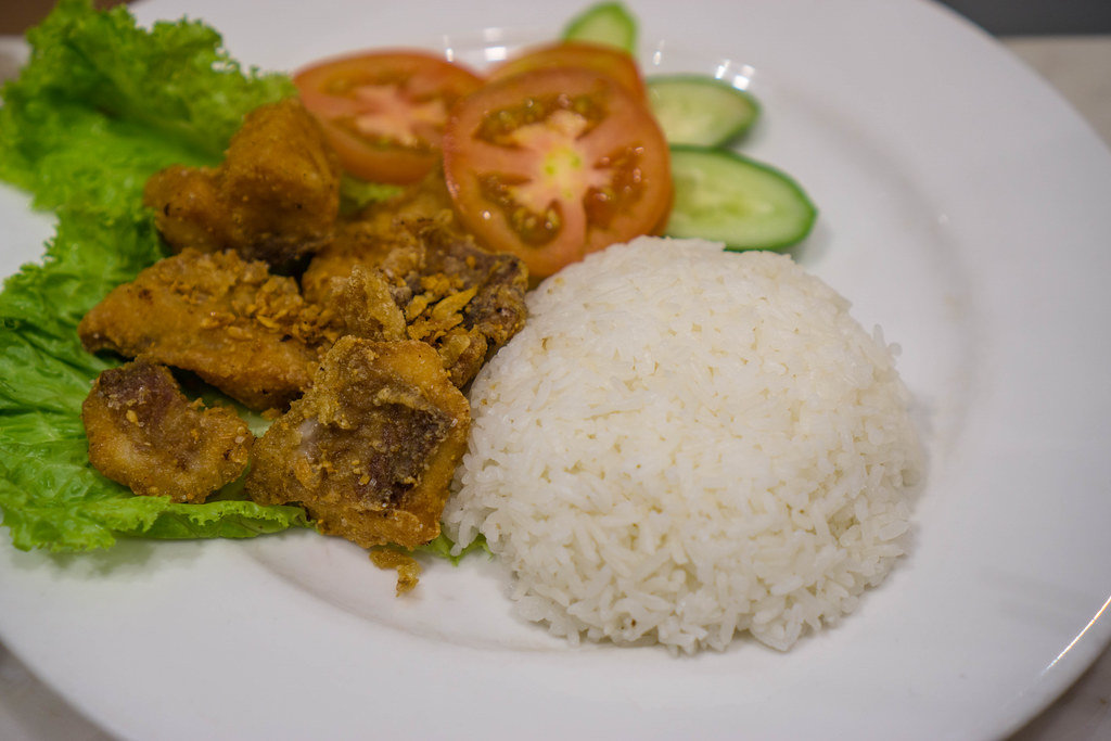 Fried Fish with Rice and Vegetables in Ho Chi Minh City