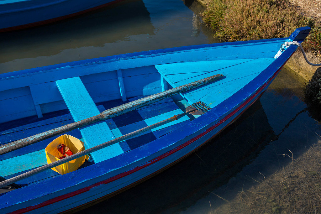 Detail of boat, fisherman harpoon and empty beer can