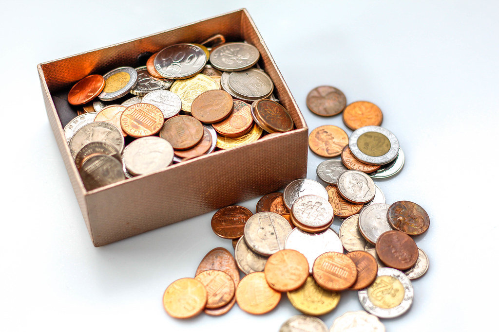 Coin in a box on a White Background