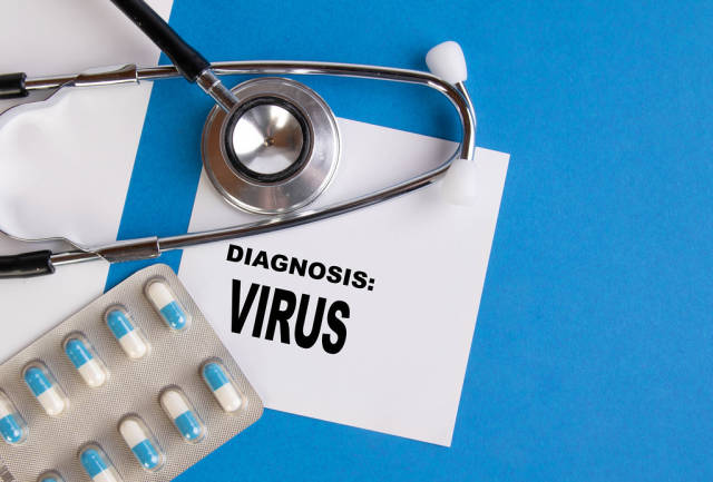 Diagnosis Virus written on medical blue folder