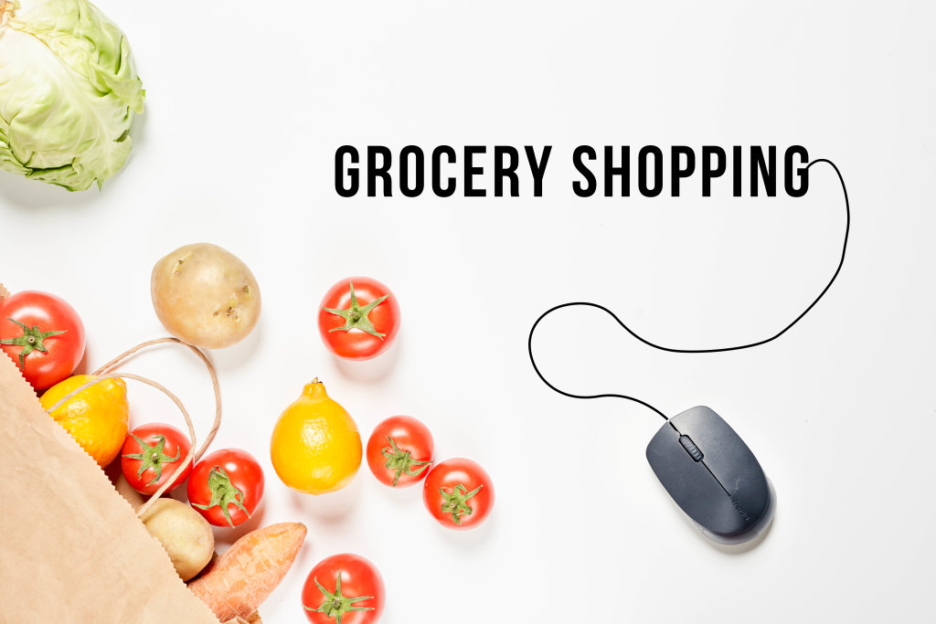 Grocery shopping concept with fresh vegetables and PC mouse